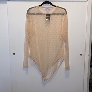 Sheer baby pink with polkadots bodysuit, stain on right shoulder